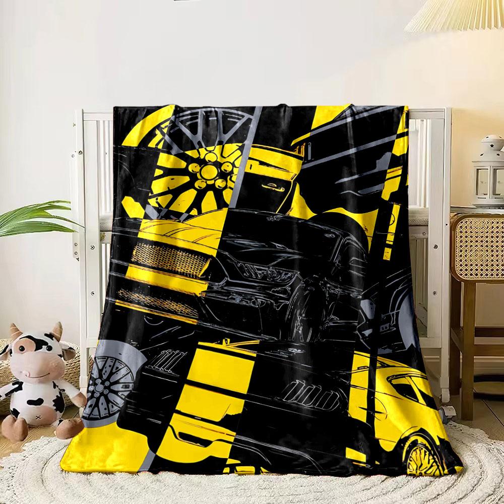 A dynamic collage of car parts in black and yellow diagonal sections. for all seasons blanket lunch break throw gift 80cm x 120cm
