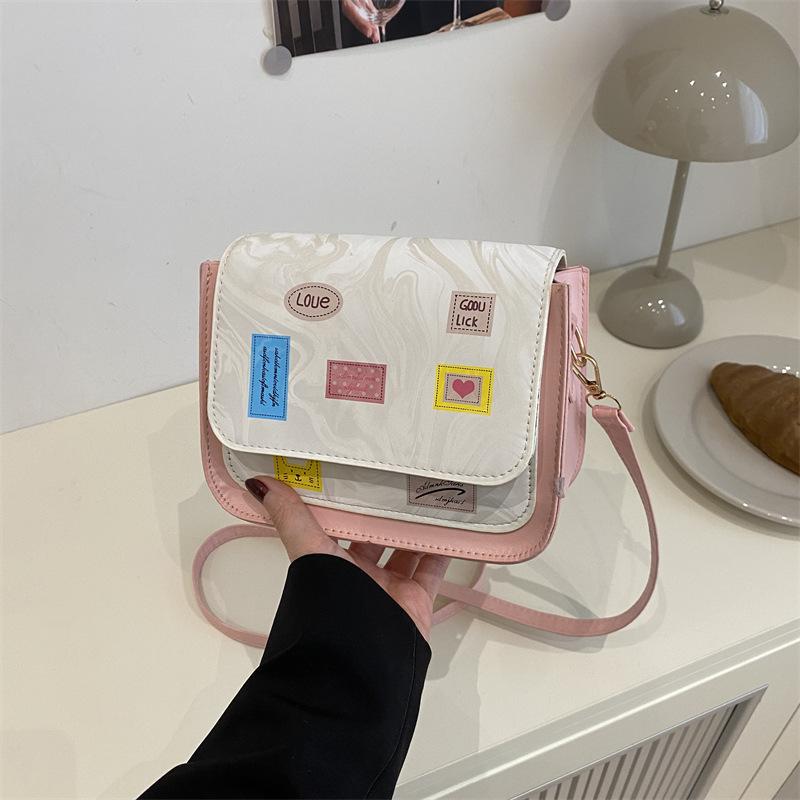 Versatile and foreign style spring new simple small square bag women's fashion high sense temperament light luxury design messenger bag
