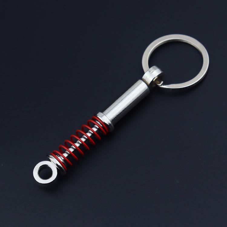 Creative Metal Car Accessories: Shock Absorber Keychain & Suspension Pendant Ring