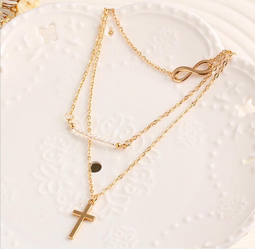 Trendy temperament Multi-layer metal cross inverted 8 collarbone chain Rice bead versatile necklace