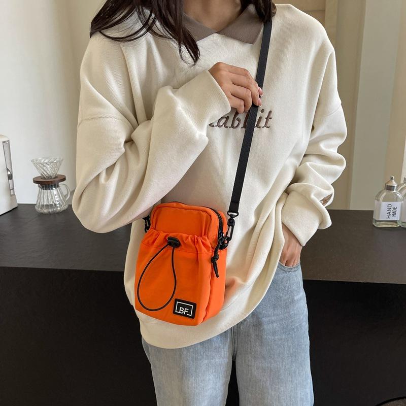 

Корейська версія легкої шопінг маленької сумки жіночої 2024 нова сумка на шнурку з нейлону літня сумка для мобільного телефону повсякденна плечова сумка-месенджер помаранчевий