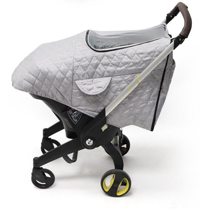 Doona+ Vier-in-één Kinderwagen: Universele Wielen, Wiegje, Klamboe, Winddichte Regenhoes, Opbergtas Accessoires