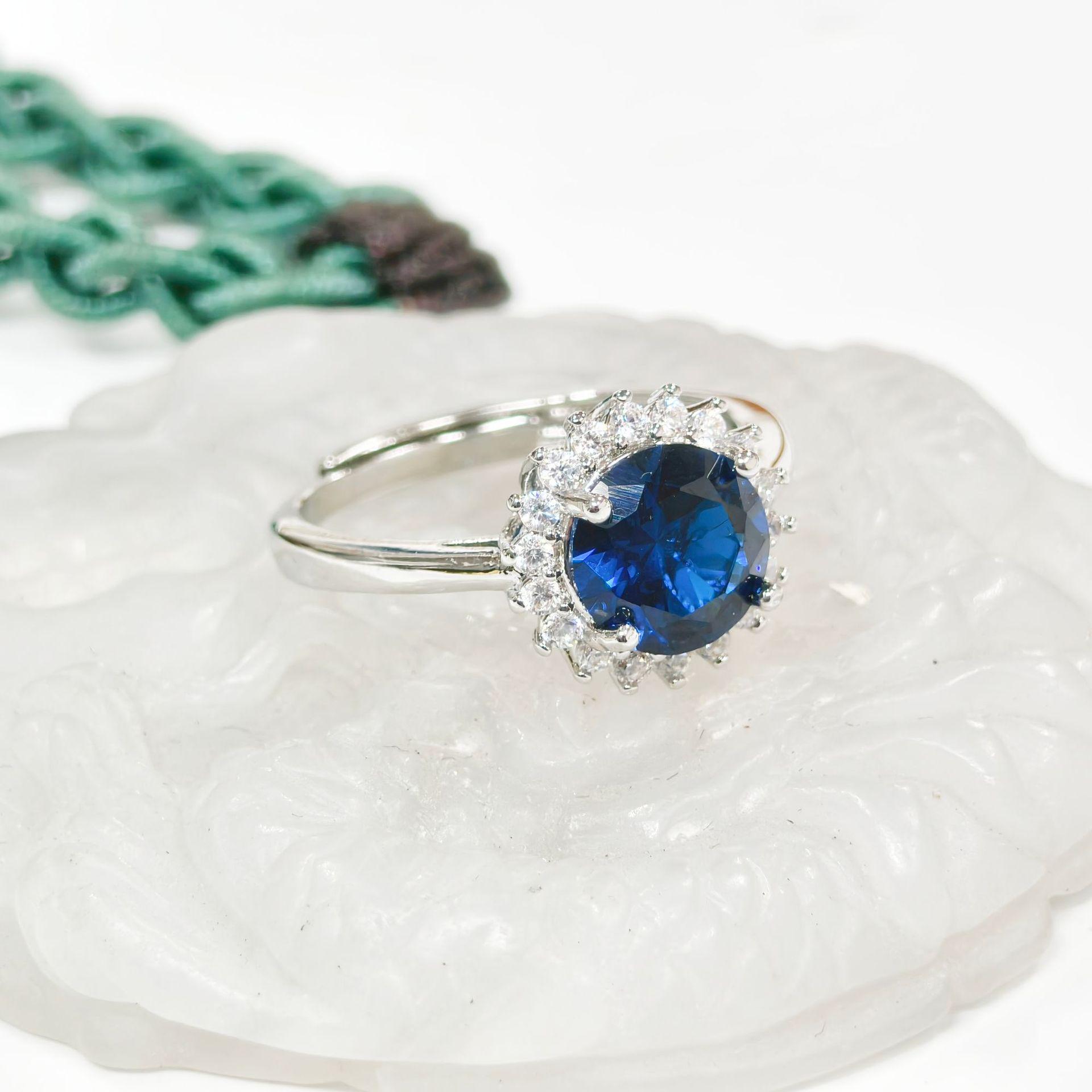 Gessen Blue Zircon Starburst Jewelry Set: Stylish Ring, Earring, Pendant Ensemble