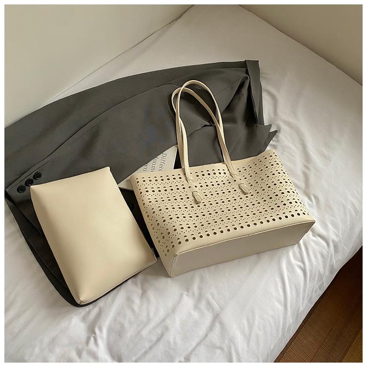 2025 spring and summer new niche high-end hollow tote bag large-capacity temperament commuting single shoulder child and mother bag