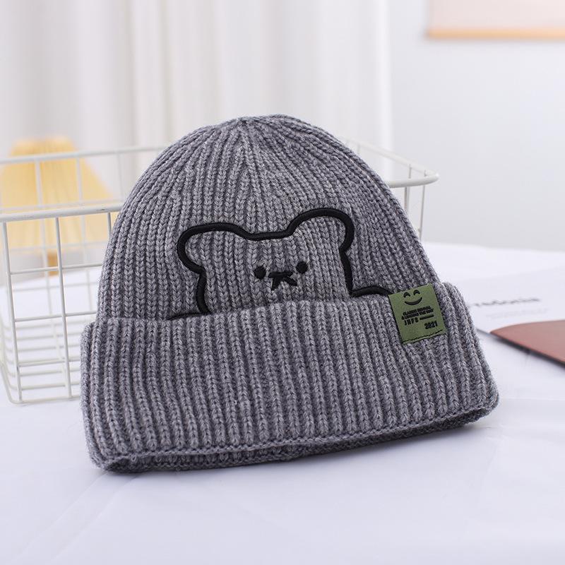 Зимові літерні вовняні шапки Жіночі корейські модні теплі в'язані шапки Шапки для захисту вух