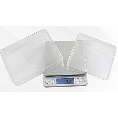 Compact, precision digital scale with 0.1g increments, weighs up to 3kg, includes Japanese instruction manual and two weighing trays