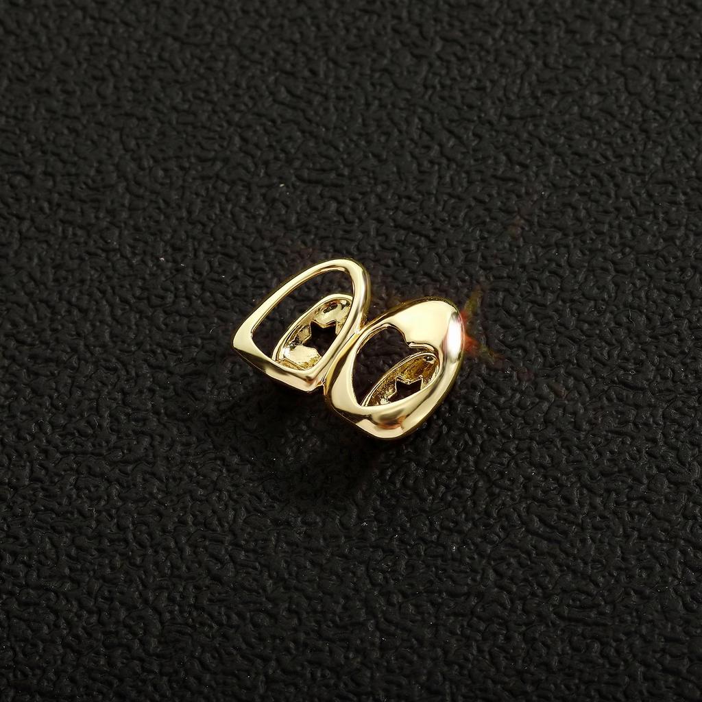 Zweifarbige Hohlherz-Gold-Grillz Streetwear Hip Hop Zähne-Set