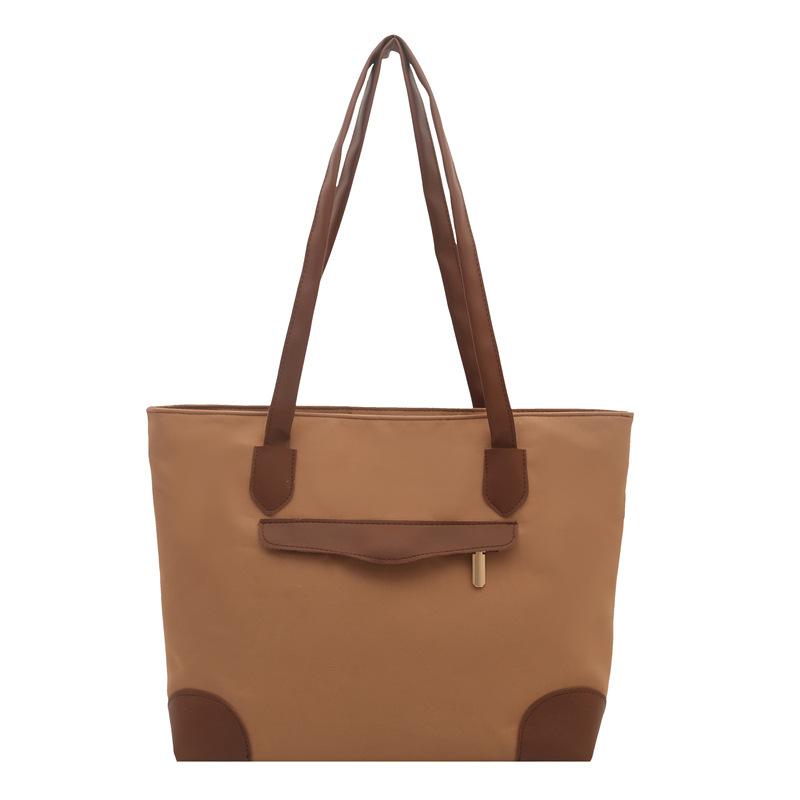 

Canvas tote bag large-capacity bag women s high-end sense new handheld shoulder bag commuter women s cloth bag коричневий