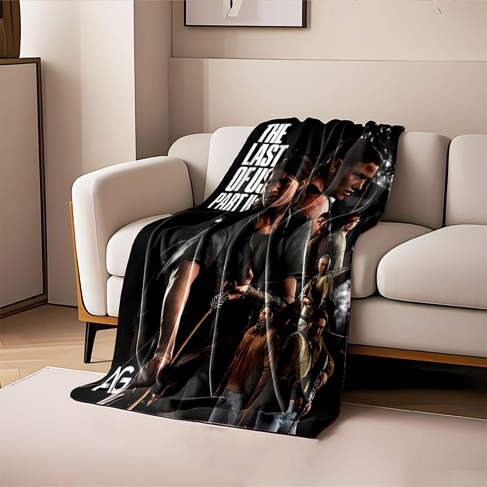 The image shows armed characters from "The Last of Us Part II" in action poses. for all seasons blanket lunch break throw gift