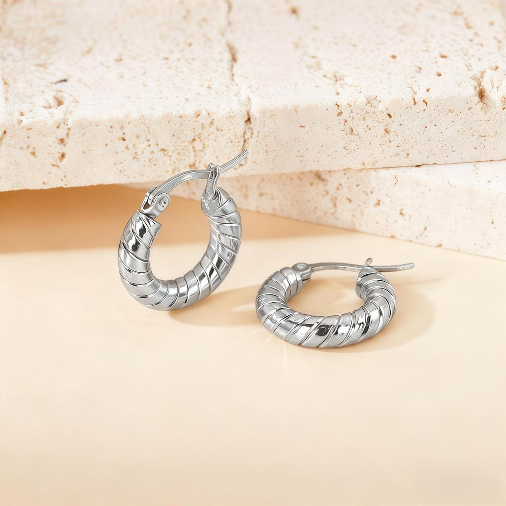 Orecchini a Cerchio Geometrici Intrecciati Europei e Americani in Acciaio al Titanio - Design Elegante e Unico per Donna