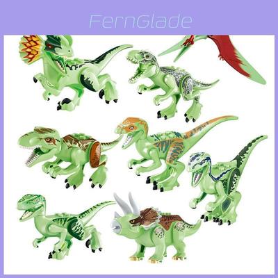 Conjunto de 8 blocos de montar fluorescentes de dinossauros jurássicos para crianças. Material atóxico e seguro.