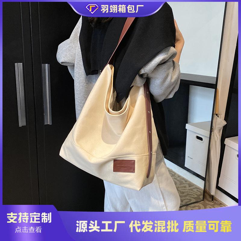 Casual large-capacity canvas bag women's new versatile shoulder messenger bag college student tote bag