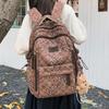 Schoolbag Korean plaid star backpack for female middle and high school students, large-capacity schoolbag, light and dirt-resistant versatile backpack