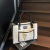 Large capacity tote bag women's new fashion niche shoulder bag versatile commuter handbag