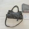 Motorcycle-style Bag with A Lady's Crossbody Strap for Commuting, A Shoulder Bag, and A Tote Bag.