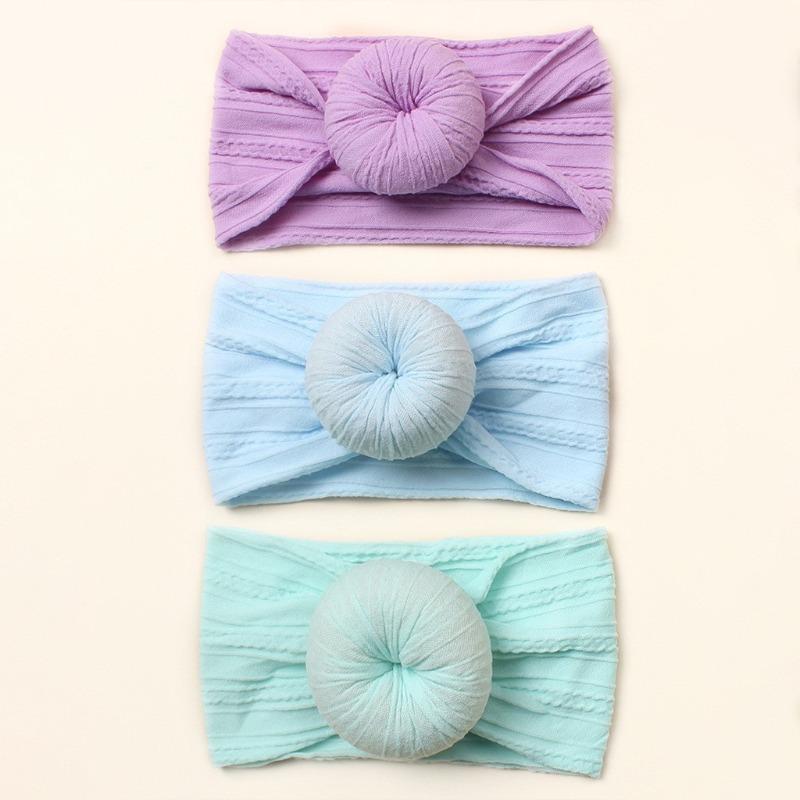

New baby headscarf, European and American children s nylon braised donut hair accessories, baby plain headband