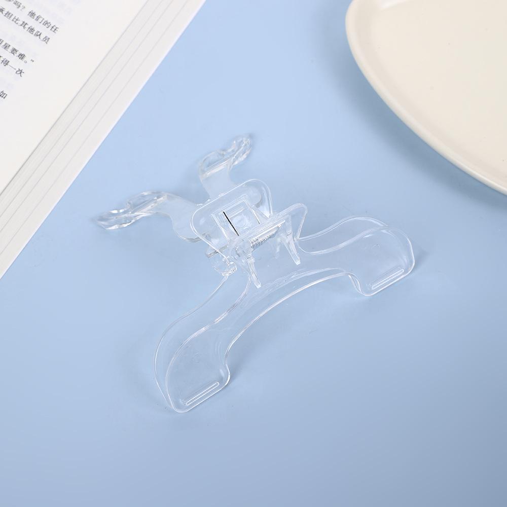 

Прозрачный пластиковый зажим для книги Простой помощник для чтения Фиксированный держатель для книги Закладки Креативный дизайн Практичный держатель для заметок для книжного магазина 1PCS прозрачный