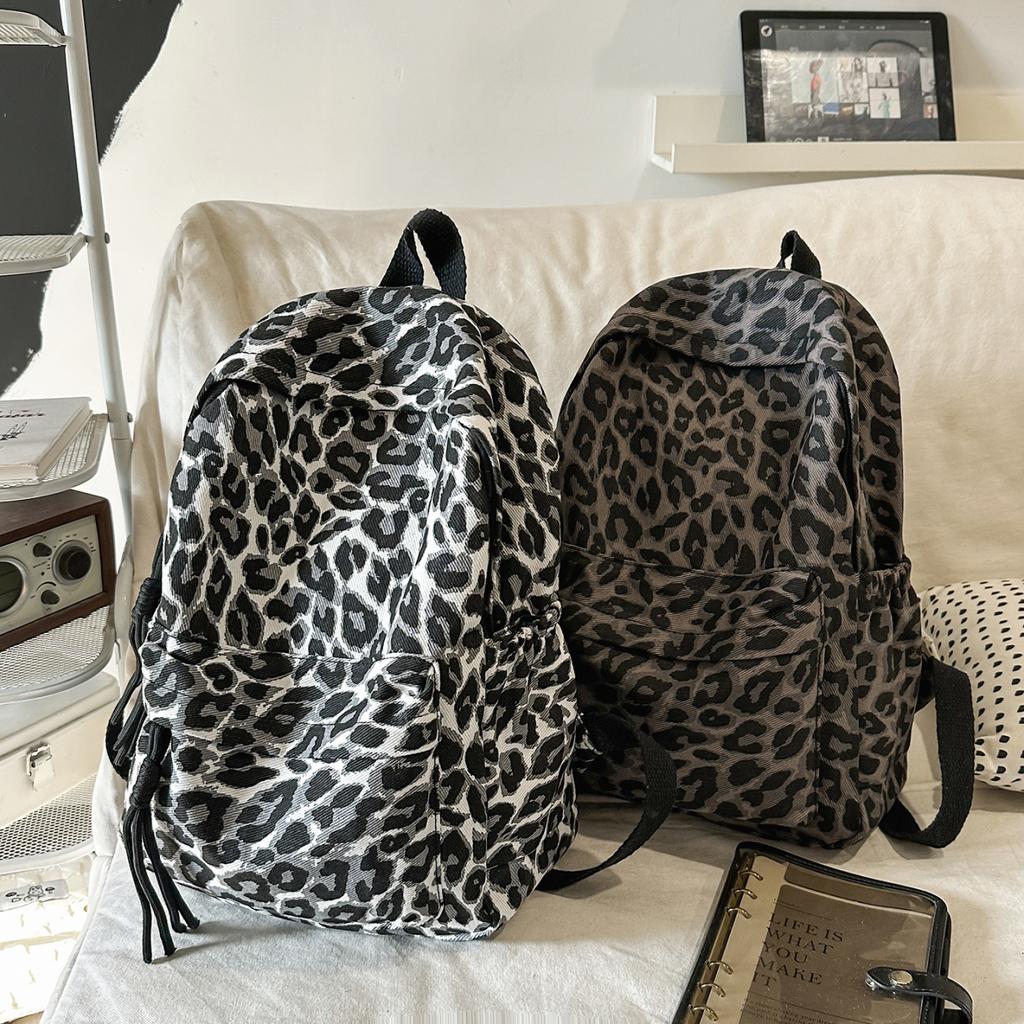 Leopard Print Backpack Casual Daily Use Trendy Street Style Lightweight Backpack for Women with Tassel Detail for School Travel and Everyday Outings
