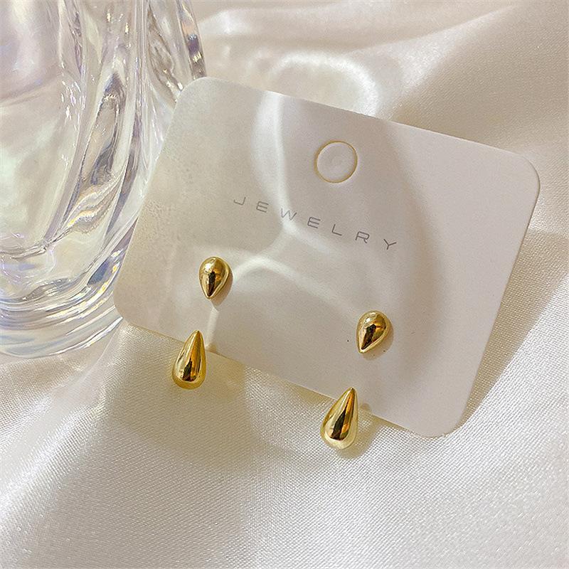 

Korean version of simple, small and smooth water drop stud earrings for women, two-wear versatile earrings, cold wind ear jewelry earrings.