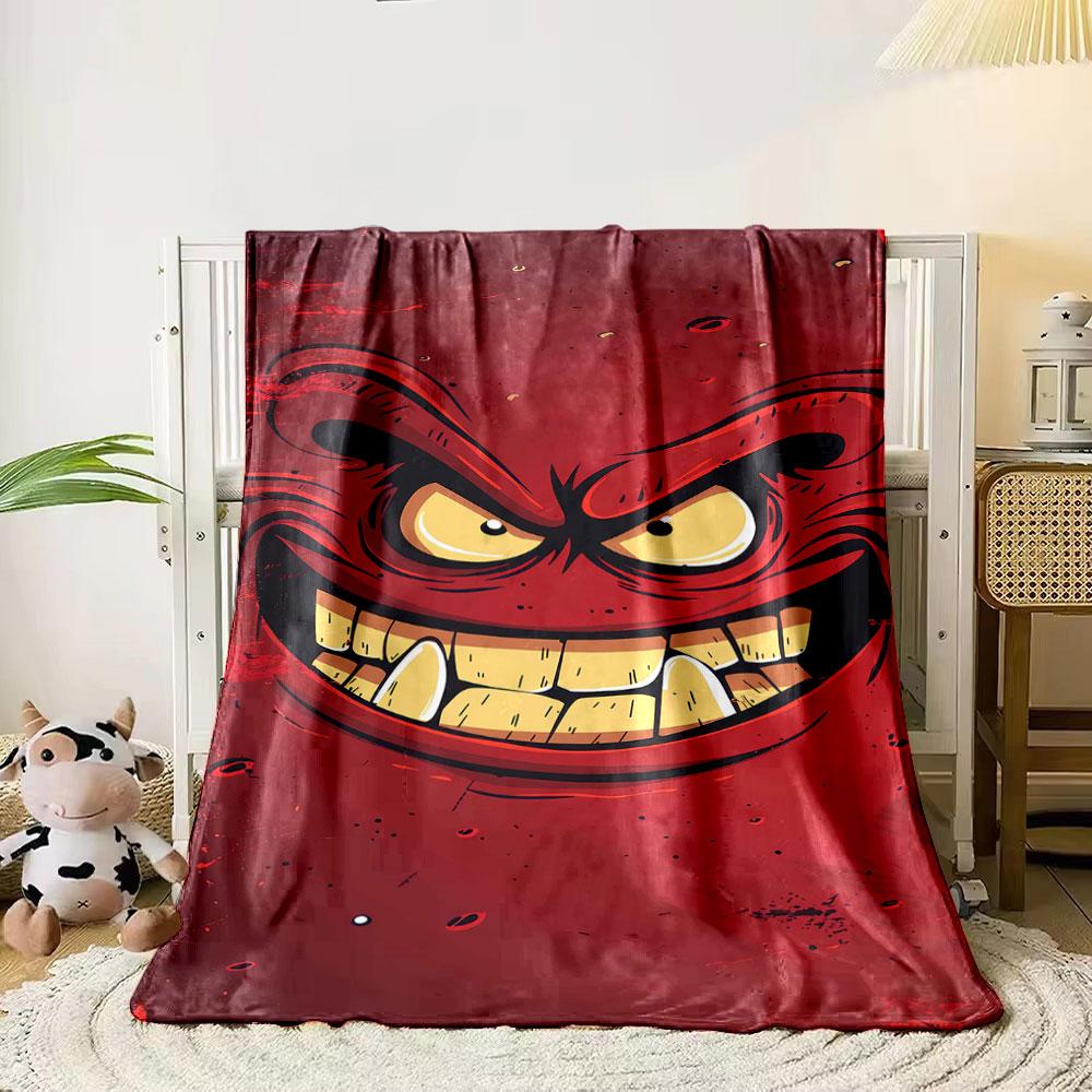 

A menacing red face with sharp teeth, angry eyes, and bold expressions. for all seasons blanket lunch break throw gift 80cm x 120cm