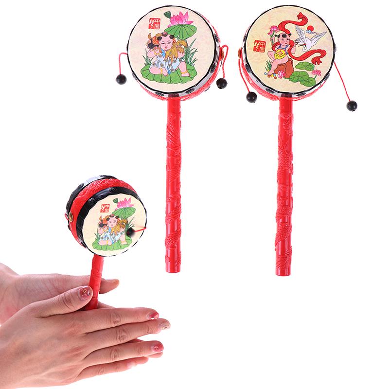 1PCS Baby Kids Cartoon Plastic Chinese Traditional Rattle Drum Spin Fun Toys Hand Bell Music Toys