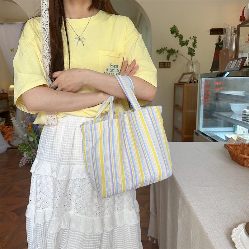 Spring and summer new pleated striped canvas bag portable bento bag storage bag large capacity hand carry