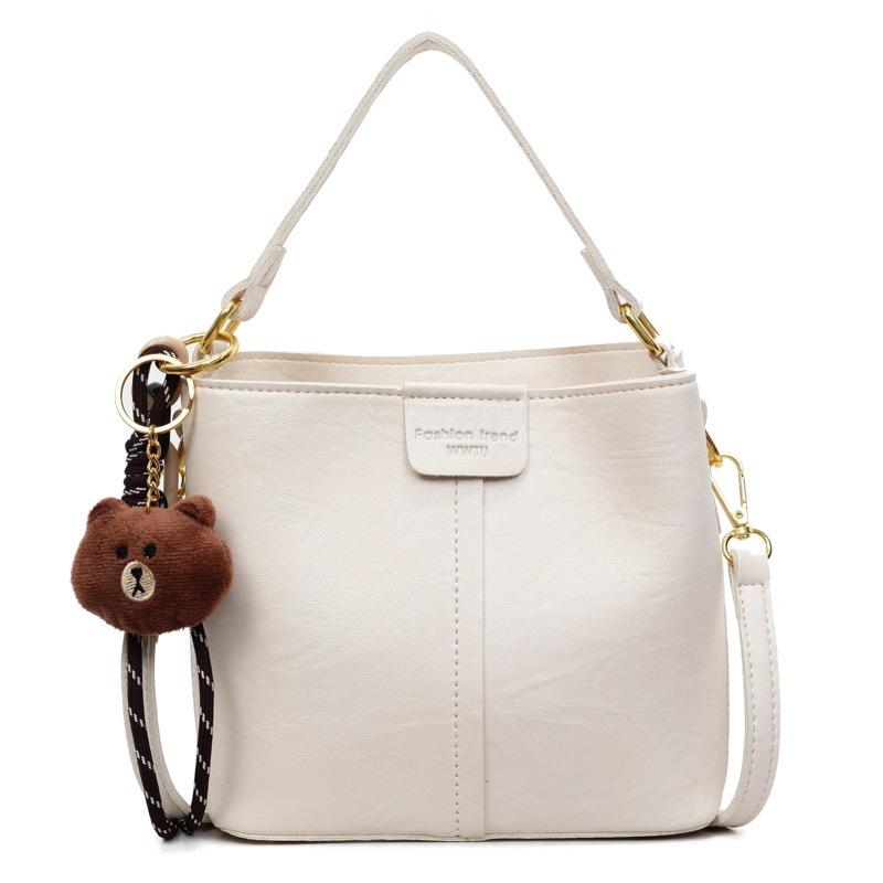 Neue trendige Mode mit Anhänger Schulter Damenhandtasche Retro Schulter Große Kapazität Breitband Umhänge Eimerhandtasche