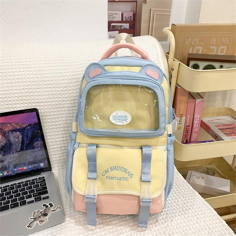 Schoolbag1011 autumn new high-value color matching design transparent pain bag cute cartoon student large-capacity backpack