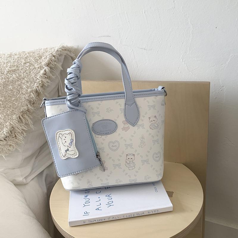 New versatile bucket bag women's high-end oblique span bag fashionable and simple commuter portable shoulder bag
