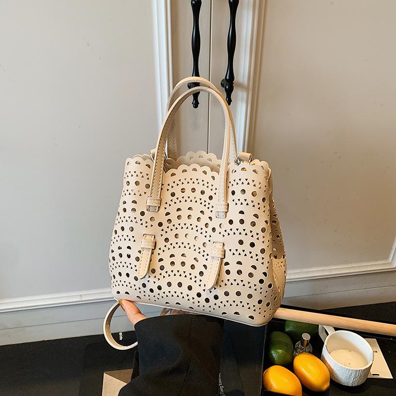 Niche design new engraved portable tote bag summer shoulder hollow vegetable basket bag women's bag messenger bag
