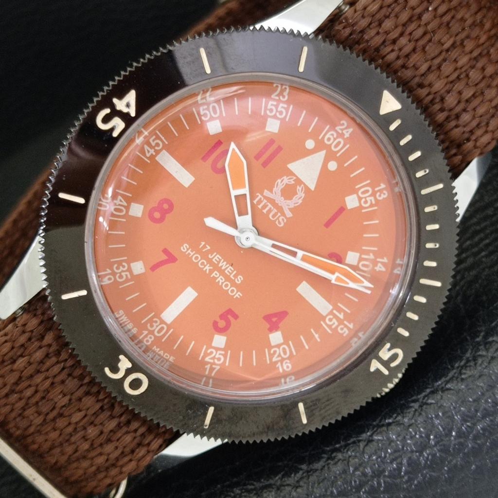 

SWISS MENS VINTAGE TITUS HAND-WINDING TURNABLE BEZEL ORANGE DIAL WATCH a700014-5 R201-a700014