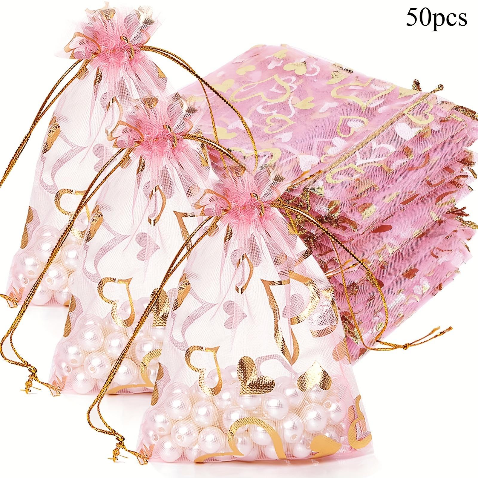 

Мешочки из органзы с принтом сердечек на кулиске. Идеально подходят для юбилея, дня рождения, свадеб, подарков. Прочные мешочки для ювелирных изделий, конфет. Праздничные принадлежности. 9x12cm