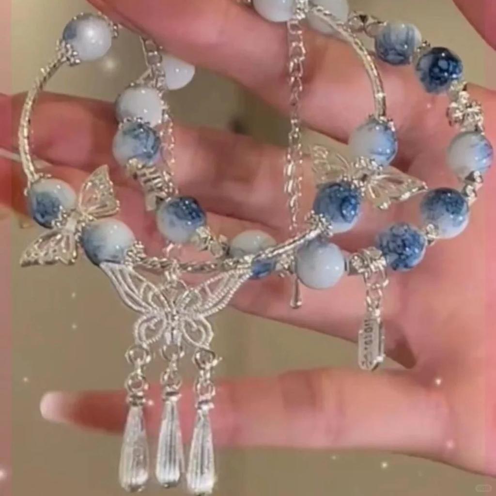 Esquema de cores azul e branco porcelana pulseira antiga franjada borboleta design de nicho feminino marca chinesa Ping An Fu