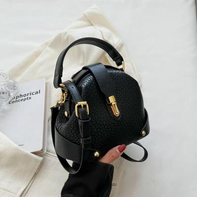 Retro Semi-round Soft Leather Rivet Corner Commuting Niche Texture Handbag