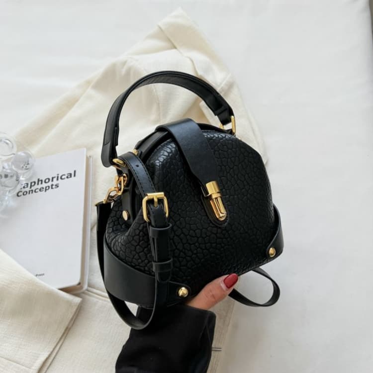 Retro Semi-round Soft Leather Rivet Corner Commuting Niche Texture Handbag