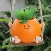 Creative Multifunctional Orange Swing Planter Pot With Swing Feature Suitable for Kids Entertainment and Home Gardening