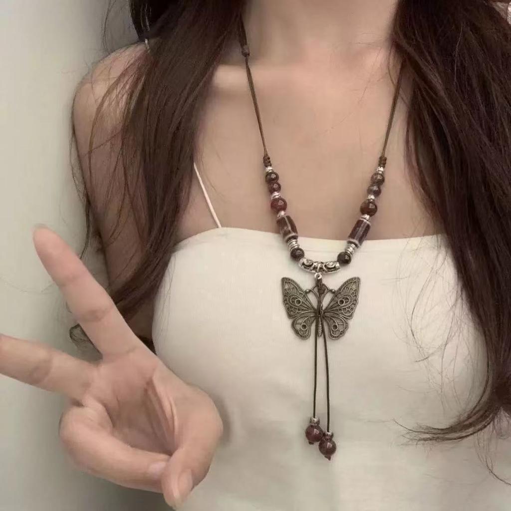 Retro pendant, ethnic style ceramic butterfly bell necklace, women's new trendy long sweater chain with accessories