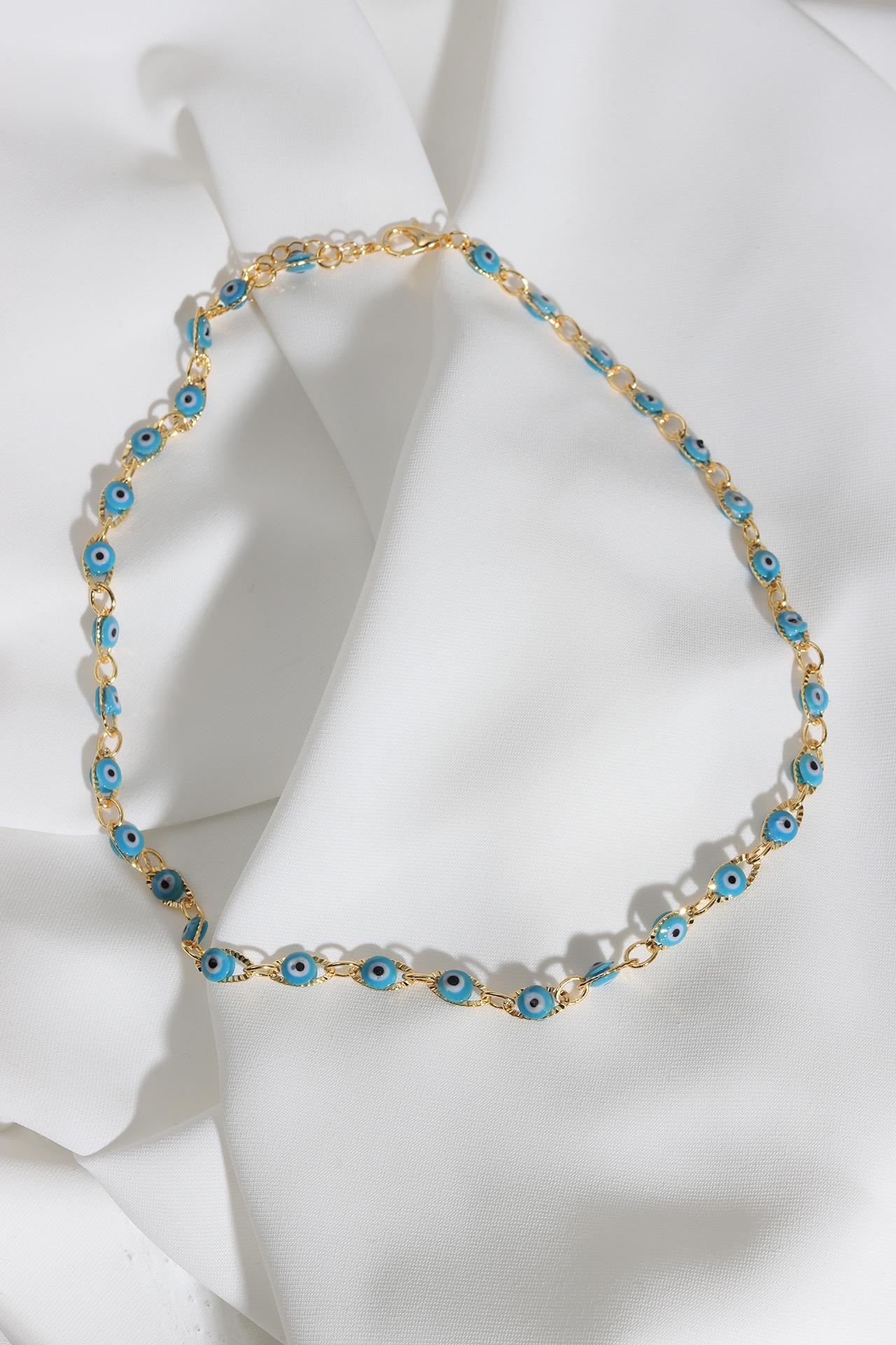 

Золотое колье с глазами-капельками