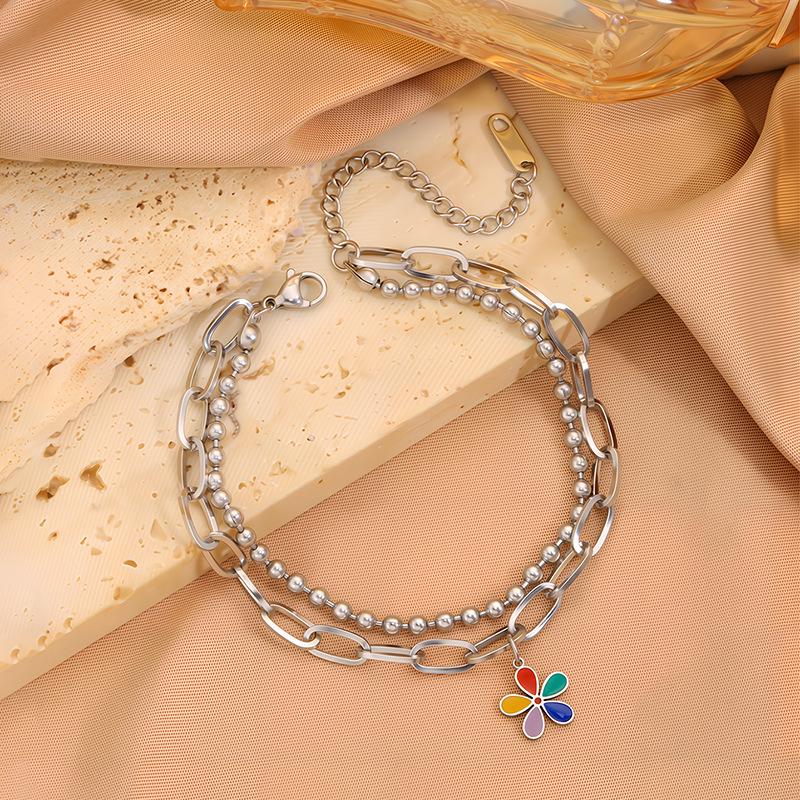 

Красочный браслет из титана, инкрустированный стразами: Элегантный дизайн цветка с пятью лепестками и двухслойной цепочкой из бусин, устойчивый к потускнению.