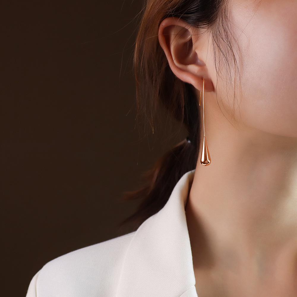Boucles d'oreilles pendantes minimalistes européennes et américaines polyvalentes en forme de goutte d'eau pour femmes