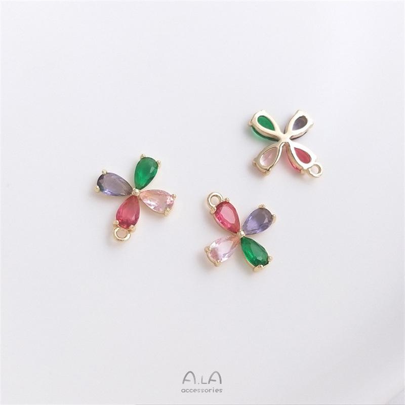 Kolczyki/naszyjnik z zawieszką w kształcie kwiatu z tęczowym okiem, wypełnione 14-karatowym złotem, z kolorowym cyrkoniem.