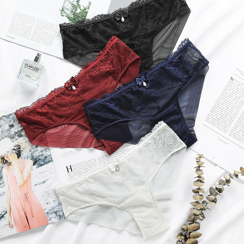 Ropa interior de encaje estilo europeo y americano con entrepierna de algodón ahuecada transpirable de talle medio para mujer