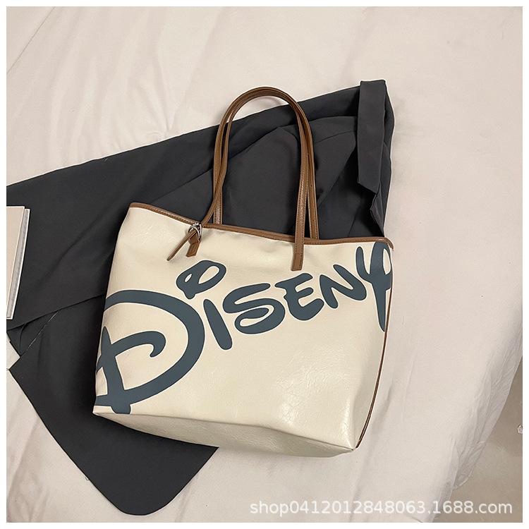 

Hong Kong style ins lazy large-capacity casual tote bag 2025 new fashion letter shoulder bag class armpit bag коричневый