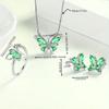 Four-piece set of butterfly stud earrings and rings with stylish, multicolored pendants, perfect for women's daily wear.