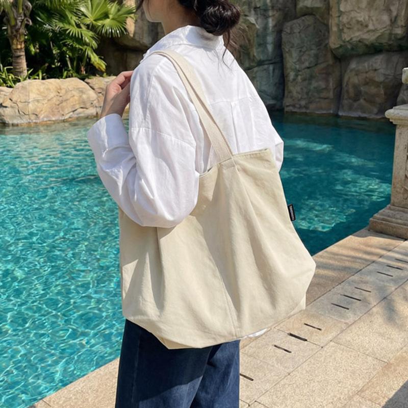 Minimalist Nylon Tote Bag with Spacious Design and Durable Handles Perfect for Everyday Use and Shopping