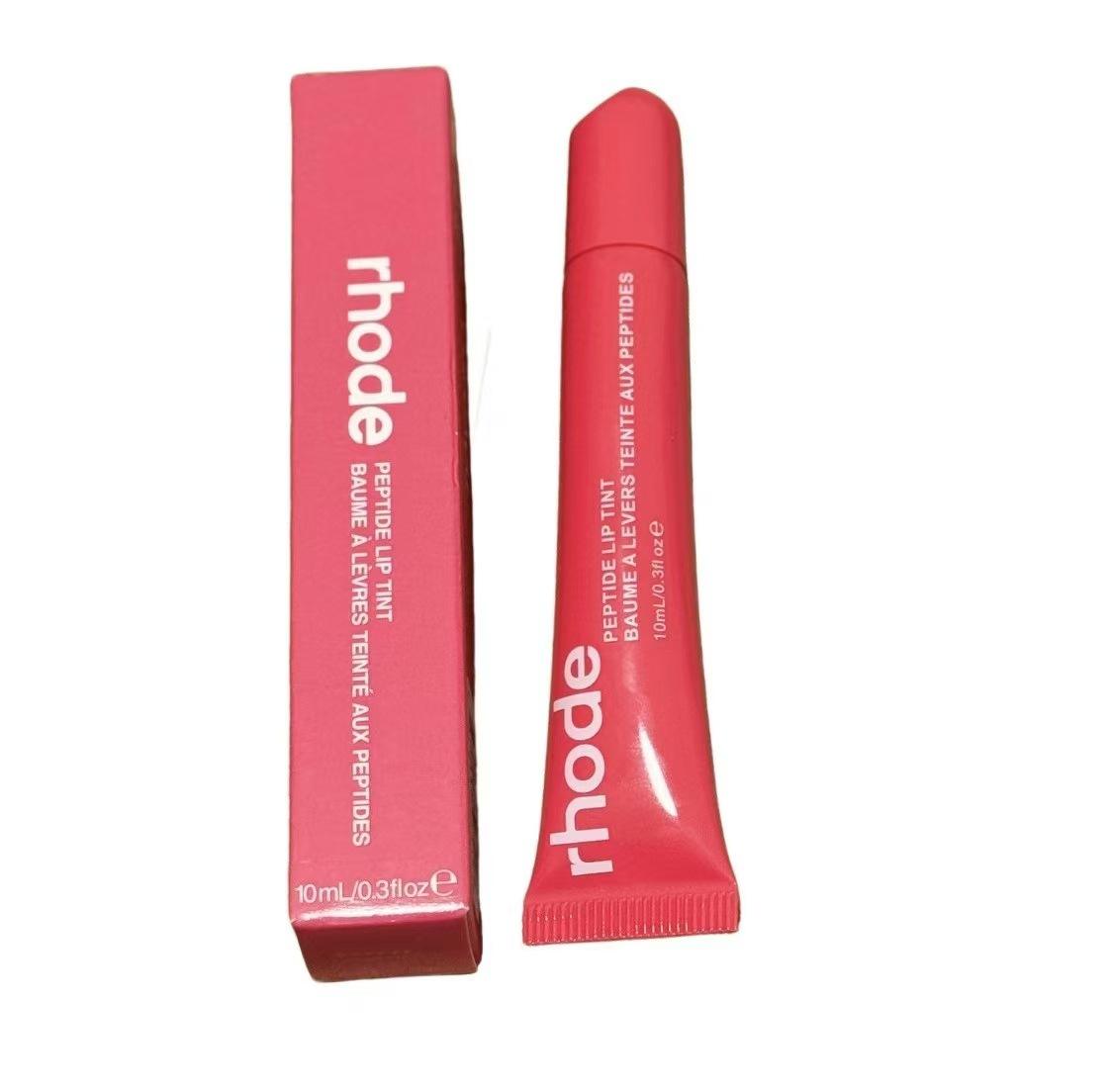 

Тонирующий бальзам для губ Хейли: Международный увлажняющий желе-уход Rhode Skin в оттенках Ribbon/Toast