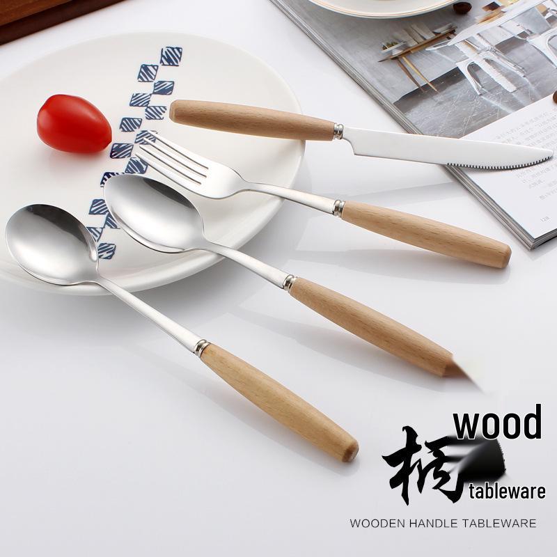 Western Cutlery Set: Stainless Steel with Wooden Handles - Includes Steak Knives, Dessert Spoons, Pasta Forks, and Spoons.
