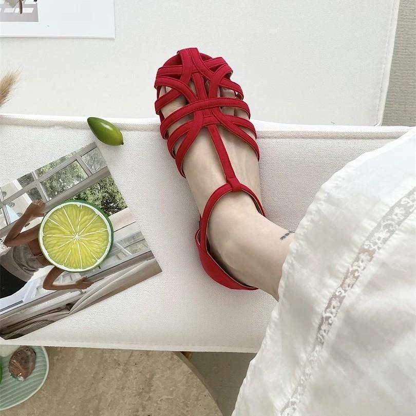 Mori women's woven hollow flat-bottomed bag head sandals women's summer new bohemian one-word strap Roman shoes genuine leather