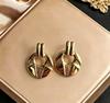 Stainless steel high-end gold earrings, niche design light luxury metal studs, temperament earrings