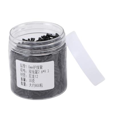 1 krabička badmintonových průchodek na raketu s dvojitým drátěným otvorem Chránič strun na badminton Tloušťka krytky 1,0 mm 2,6x9,3 mm N12 Černý